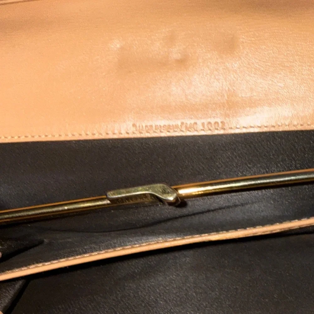 Dior Tan and Brown Monogram Wallet with snap clip close pouch.